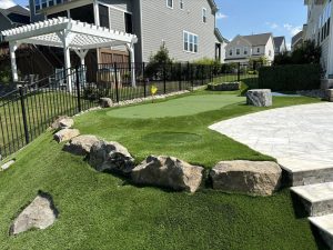 putting green with large boulders to stop golf balls