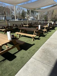 fake grass in the outdoor picnic area of a restaurant