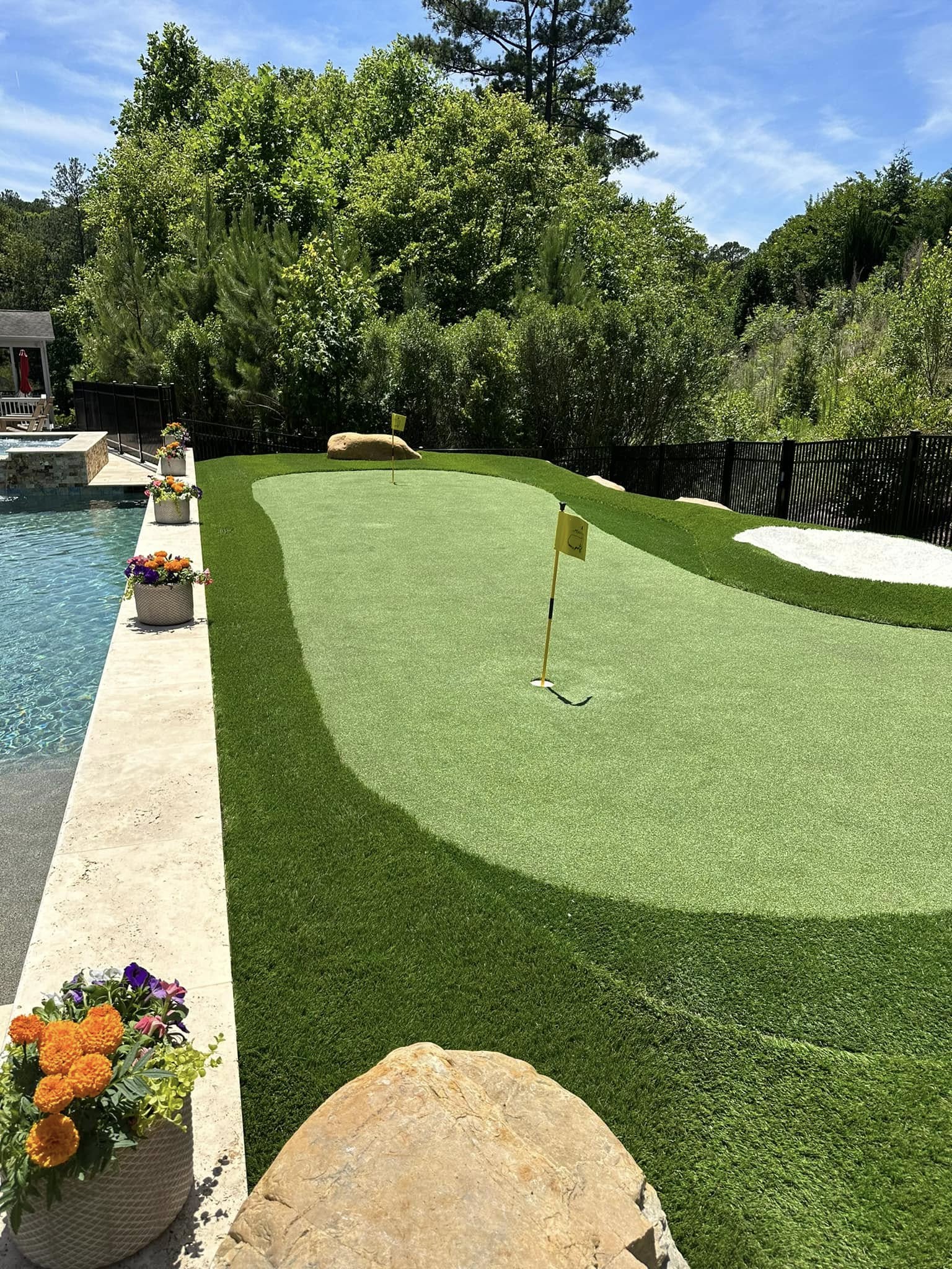 Artificial turf installation next to pool Clayton NC